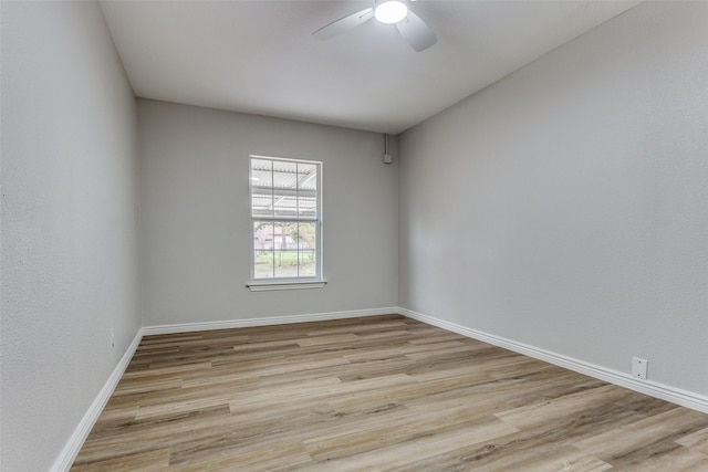 unfurnished room featuring ceiling fan and light wood-type flooring