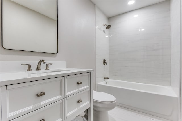 full bathroom with vanity, toilet, and tiled shower / bath