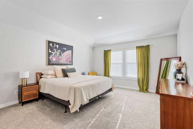 bedroom with carpet and lofted ceiling