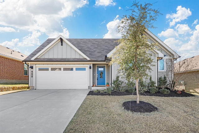 single story home featuring concrete driveway, a shingled roof, board and batten siding, and an attached garage