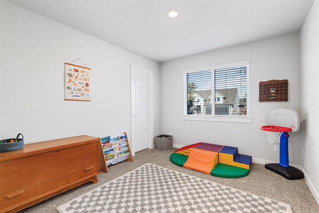 game room with carpet and baseboards