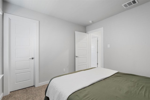 bedroom featuring carpet, visible vents, and baseboards