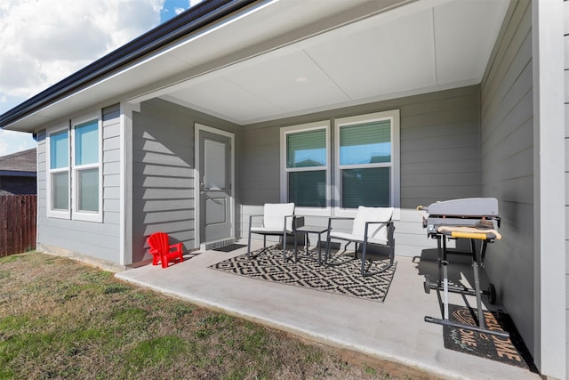 view of patio featuring fence