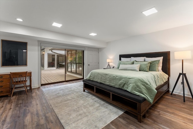 bedroom with access to exterior and dark hardwood / wood-style floors