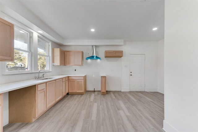 kitchen with decorative light fixtures, light hardwood / wood-style floors, sink, and light brown cabinetry