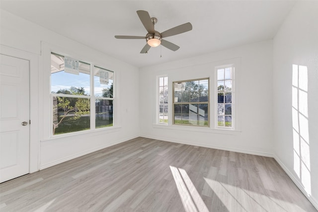 unfurnished room with ceiling fan and light hardwood / wood-style flooring