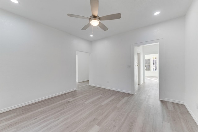 unfurnished room featuring ceiling fan and light hardwood / wood-style flooring