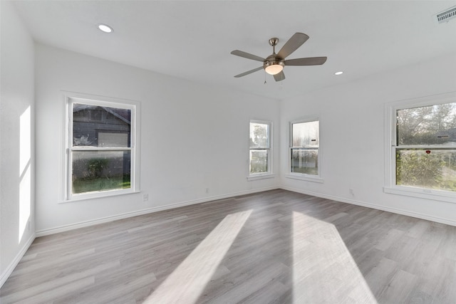 unfurnished room featuring ceiling fan and light hardwood / wood-style floors