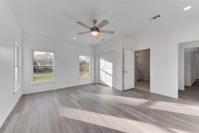 unfurnished room featuring ceiling fan and light hardwood / wood-style floors