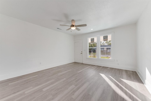 unfurnished room featuring ceiling fan and light hardwood / wood-style flooring