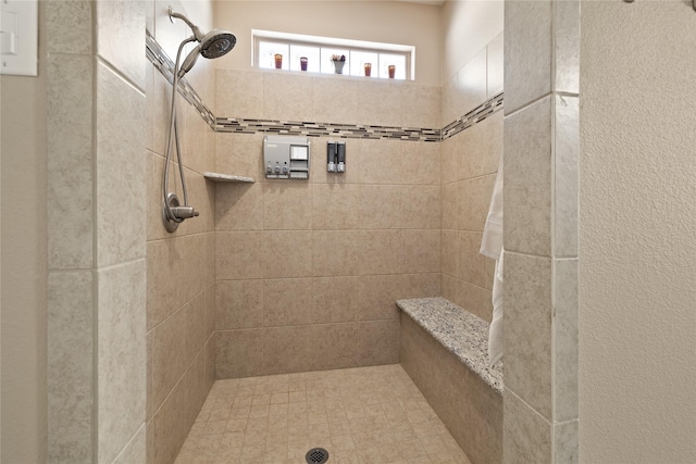 bathroom featuring tiled shower