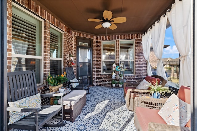 view of patio featuring ceiling fan