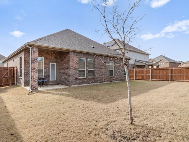 rear view of property with a patio area