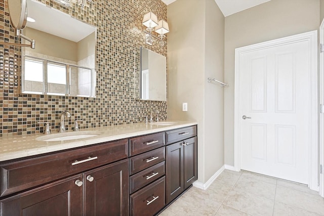 bathroom featuring tile patterned floors, backsplash, a shower with door, and vanity