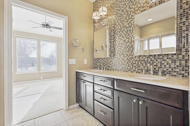 bathroom with ceiling fan, tile patterned floors, decorative backsplash, a shower with door, and vanity