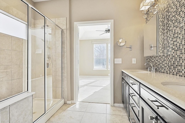 bathroom with vanity, tasteful backsplash, tile patterned floors, and an enclosed shower