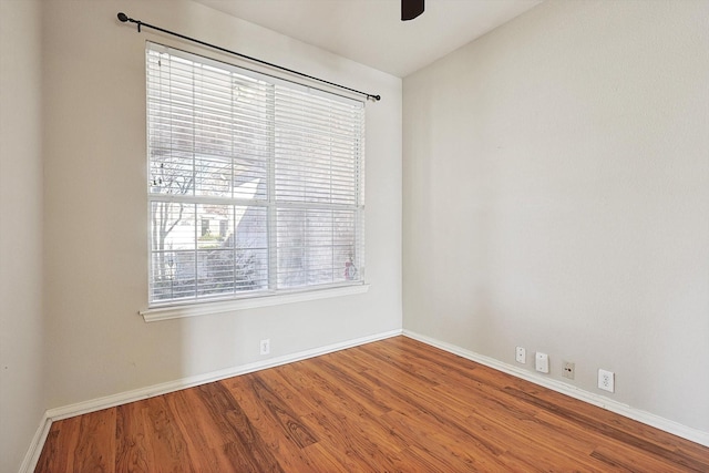 spare room featuring hardwood / wood-style floors, ceiling fan, and vaulted ceiling