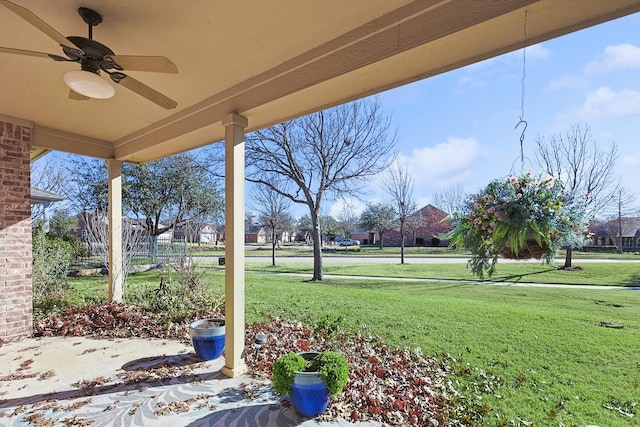 view of yard featuring ceiling fan