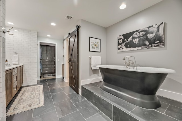 bathroom with a bathtub and vanity