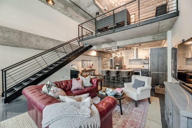 living room with a towering ceiling