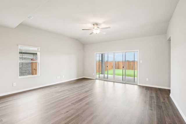 spare room featuring ceiling fan and dark wood-type flooring