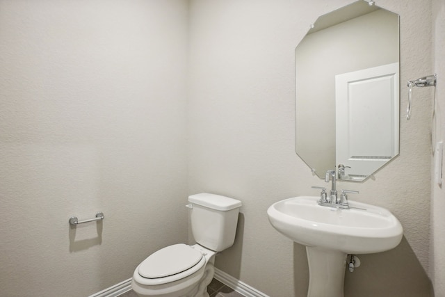 bathroom with toilet and sink