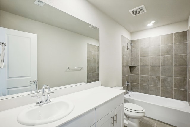 full bathroom with tile patterned floors, vanity, toilet, and tiled shower / bath