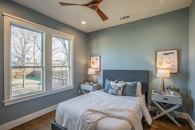 bedroom featuring ceiling fan and dark hardwood / wood-style floors