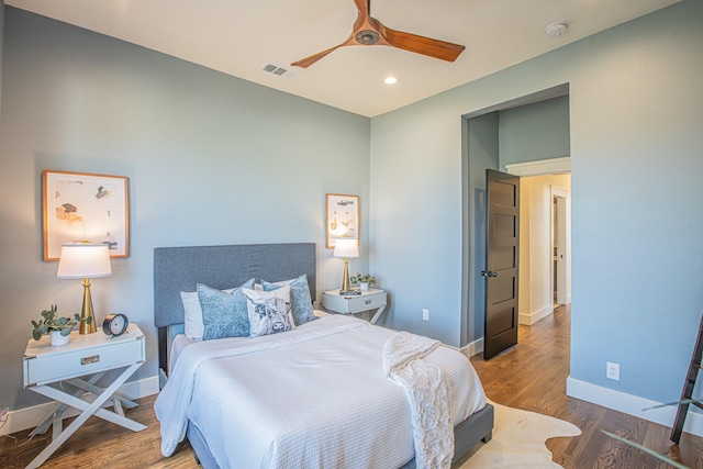 bedroom with hardwood / wood-style flooring and ceiling fan