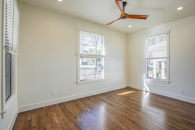 unfurnished room with ceiling fan, a healthy amount of sunlight, and dark hardwood / wood-style flooring