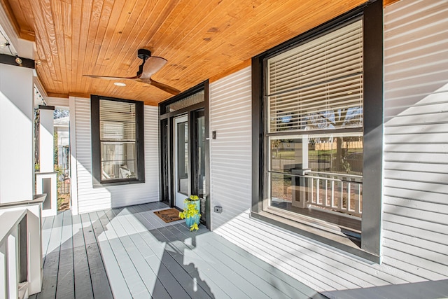 wooden terrace featuring ceiling fan