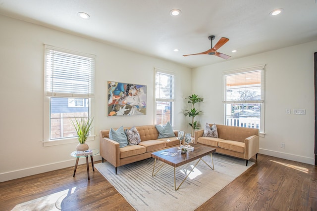 living room featuring hardwood / wood-style flooring and ceiling fan