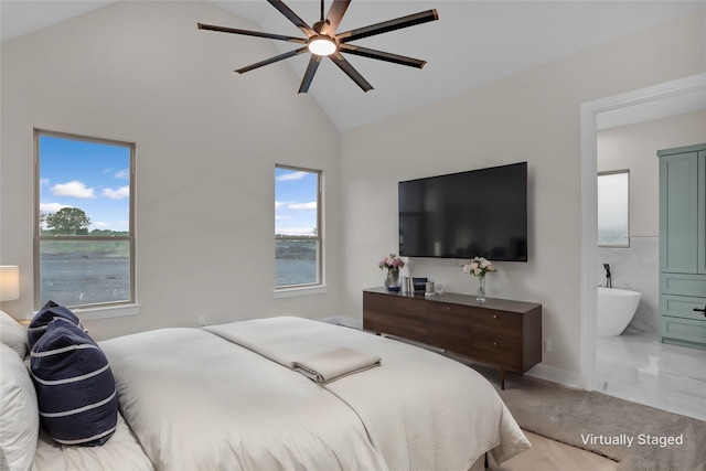 carpeted bedroom featuring high vaulted ceiling, ceiling fan, connected bathroom, and multiple windows