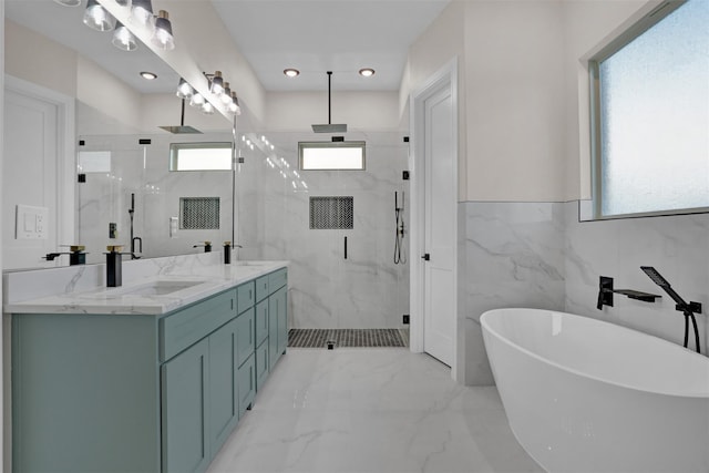 bathroom with independent shower and bath, vanity, and tile walls