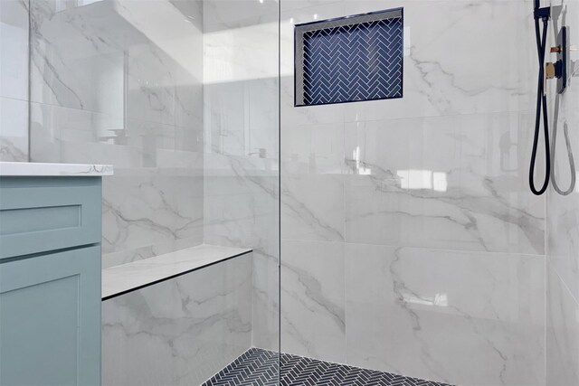 bathroom with tiled shower