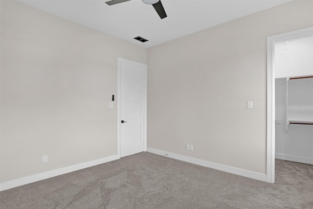 unfurnished bedroom with ceiling fan and light carpet