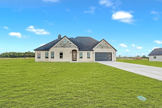 view of front of house featuring a front yard and a garage