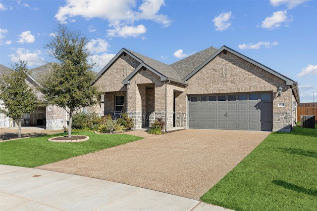 view of front facade with a garage, central AC unit, and a front lawn