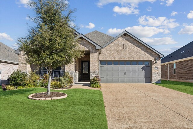 view of front facade with a garage and a front yard