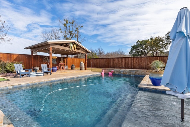 view of swimming pool with a gazebo and a patio