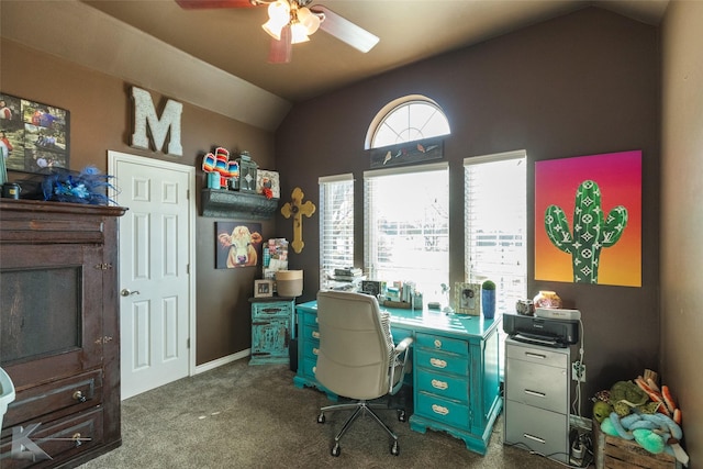 home office with carpet floors, ceiling fan, and vaulted ceiling