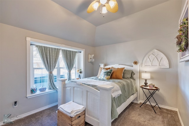 bedroom featuring dark colored carpet, vaulted ceiling, and ceiling fan