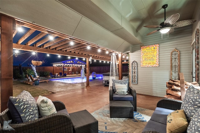 view of patio featuring ceiling fan and a fenced in pool