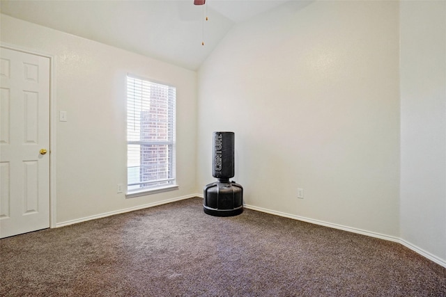 unfurnished room featuring ceiling fan, carpet, and vaulted ceiling