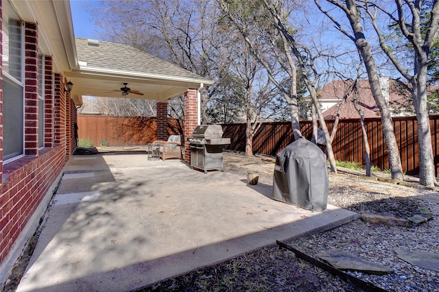 view of patio / terrace with ceiling fan and a grill