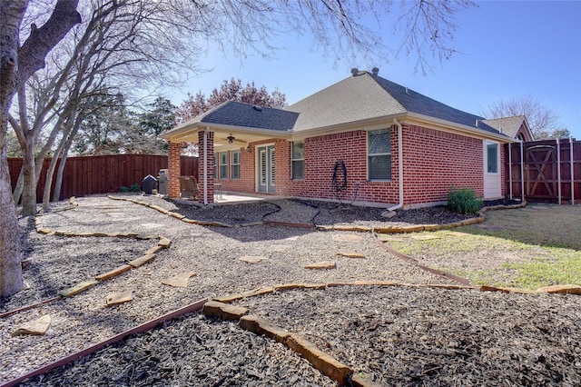 exterior space with ceiling fan and a patio area