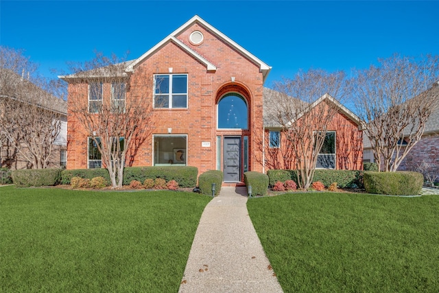 front facade featuring a front lawn