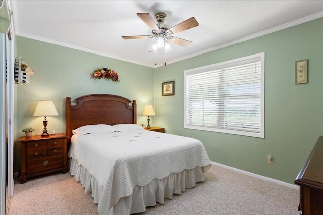 bedroom featuring ceiling fan, light colored carpet, and ornamental molding