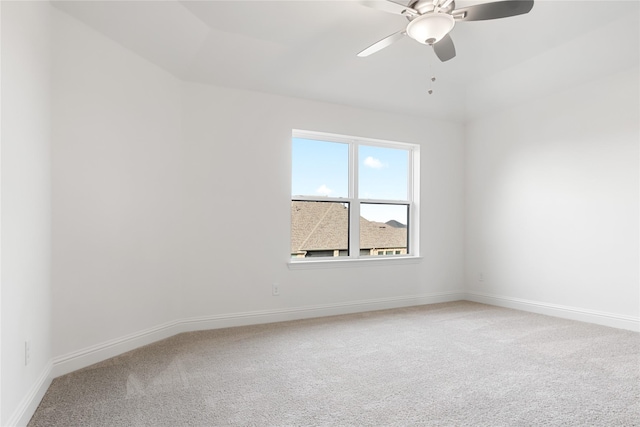 unfurnished room featuring carpet flooring, ceiling fan, and baseboards