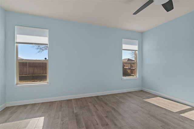 unfurnished room featuring light hardwood / wood-style flooring and ceiling fan